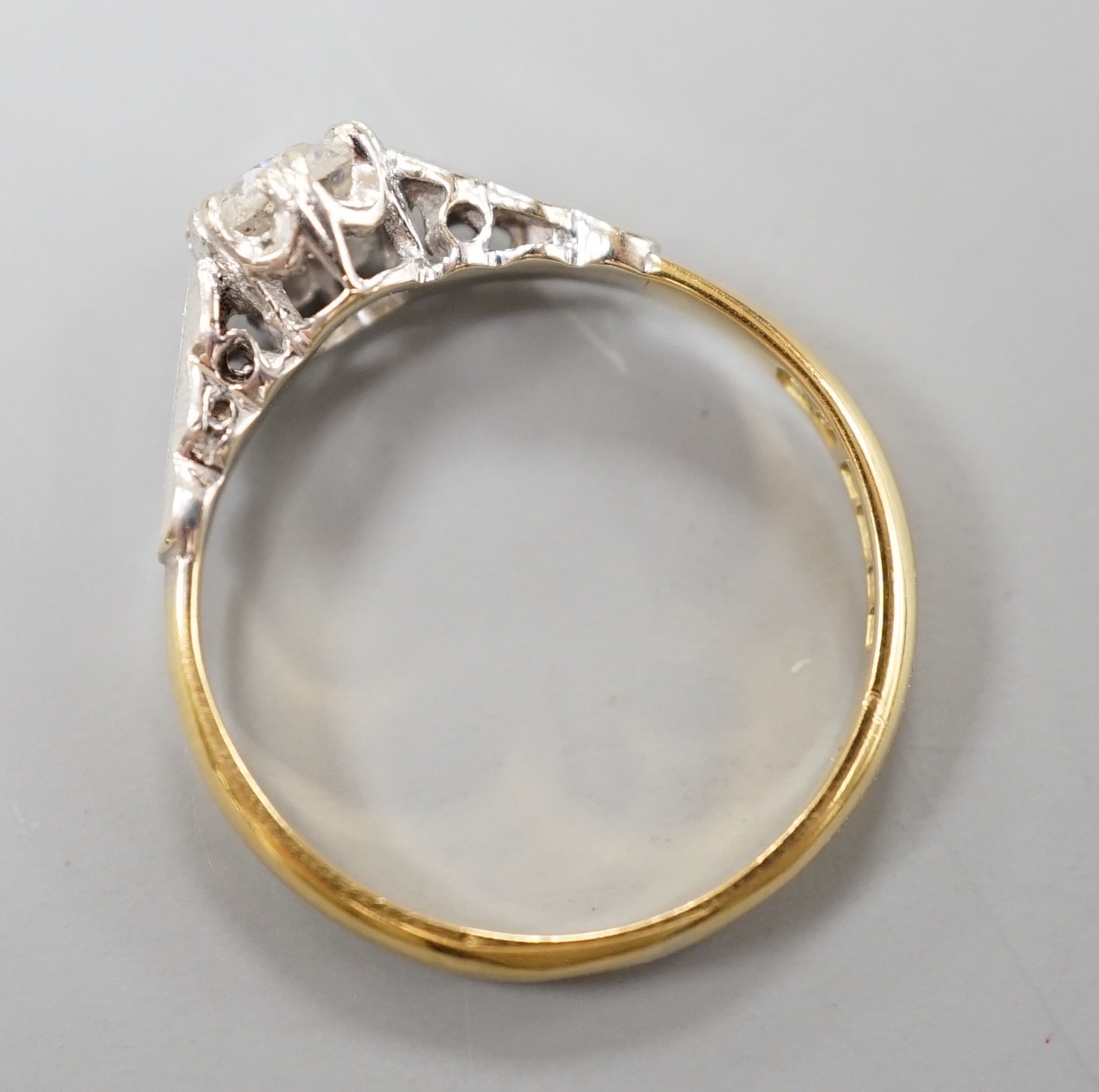 A modern 18ct gold and solitaire diamond ring, size M, gross weight 2.7 grams.